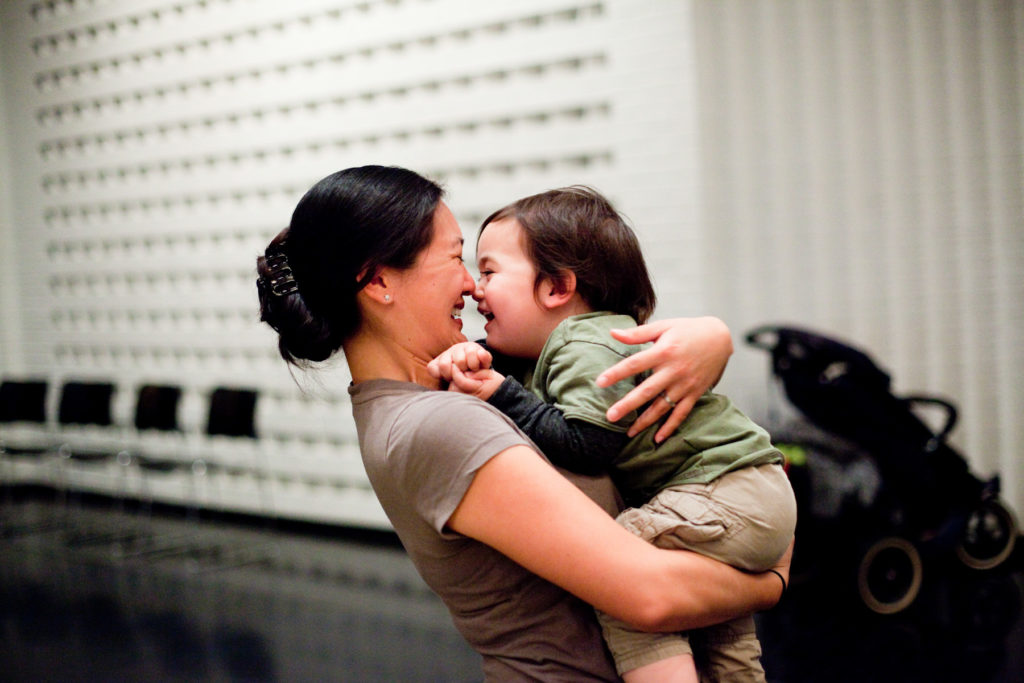 A mother hugs her child