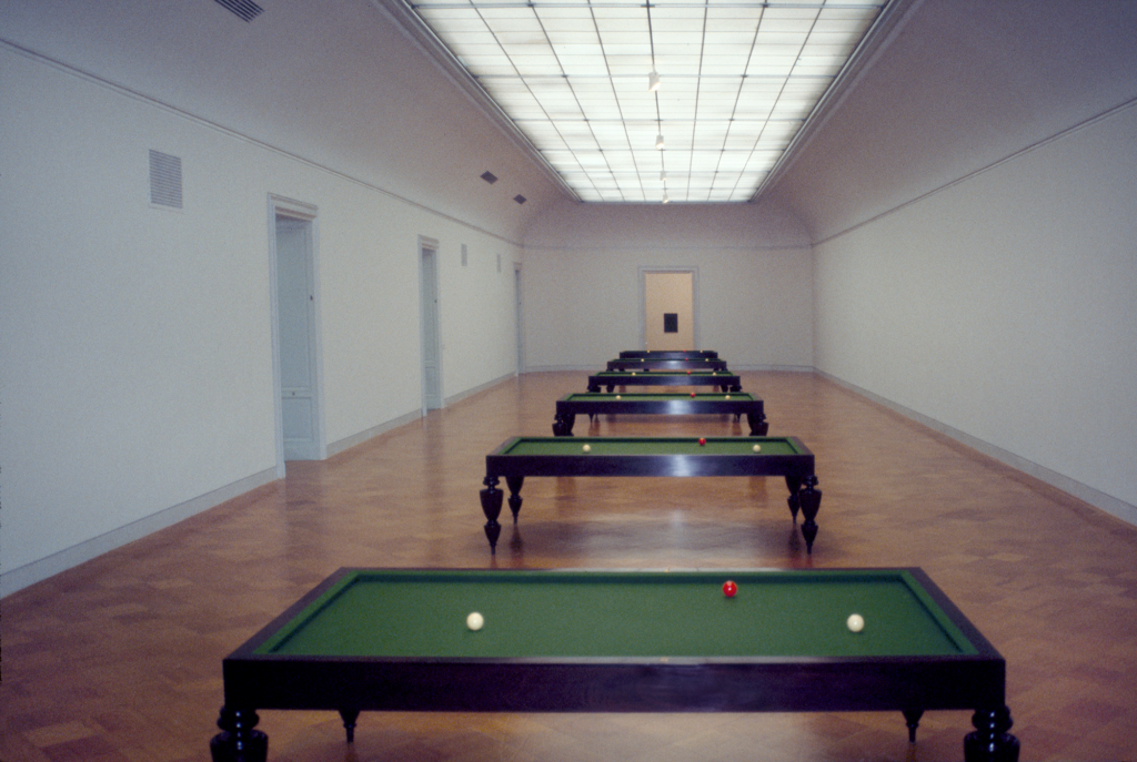 five billiards tables standing in a row with two white balls and one red ball placed in the same position on each